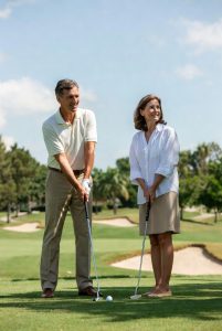 Couple golfing in Sea Trail Plantation in Sunset Beach, NC